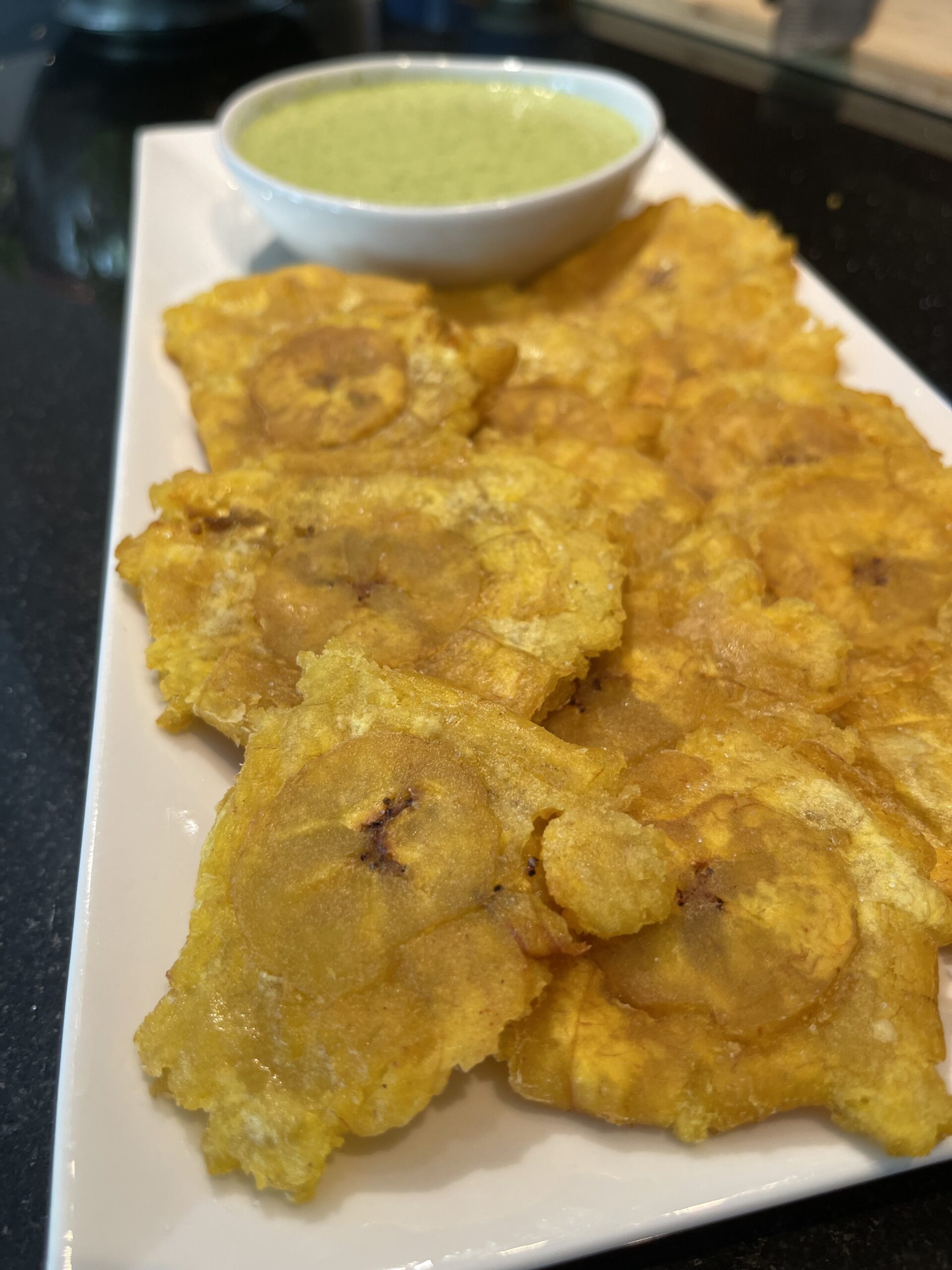 Tostones with green sauce